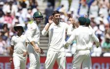 Proteas fast bowler (centre) Duanne Olivier celebrates the fall of a Pakistani wicket with his teammates during day one of the second Test at Newlands on 3 January 2019. Picture: AFP