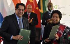 President of the NDB, Mr. Kundapur Vaman Kamath and Maite Nkoana-Mashabane signing agreements during the official launch of the African Regional Centre of the Brics New Development Bank in Sandton. Picture: GCIS.