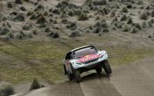 Peugeot’s driver Stephane Peterhansel and his co-driver Jean Paul Cottret of France compete during the Stage 7 of the Dakar 2017 between La Paz and Uyuni, Bolivia, on 9 January, 2017. Picture: AFP.