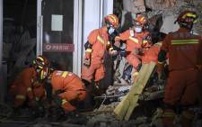 This photo taken on 29 April 2022 shows rescuers searching for survivors at a collapsed six-storey building in Changsha, central China’s Hunan province. Picture: CNS/AFP