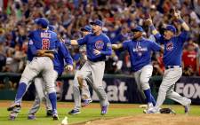 The Chicago Cubs celebrate after defeating the Cleveland Indians 8-7 in Game Seven of the 2016 World Series at Progressive Field on 2 November, 2016 in Cleveland, Ohio. Picture: AFP.