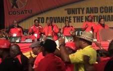 SACP leader Blade Nzimande is joined by Cosatu members in song at the union federation's National Congress. Picture: Vumani Mkhize/EWN.