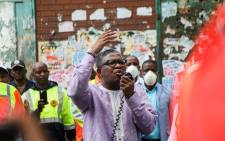 Transport Minister Fikile Mbalula addresses members of the Gauteng traffic police, taxi associations and commuters outside the MTN Noord taxi rank on 1 April 2020. Picture: Kayleen Morgan/EWN