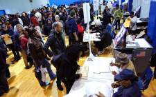 People wait in line cast their vote at Samuels Community Center in the presidential election November 8, 2016 in the Harlem neighborhood of New York City. Picture: AFP.