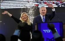 FILE: Israeli Prime Minister Benjamin Netanyahu, accompanied by his wife Sara, greets supporters on election night at his Likud Party headquarters in the Israeli coastal city of Tel Aviv early on 10 April 2019. Picture: AFP
