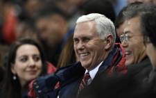 US Vice President Mike Pence talks to South Korea's President Moon Jae-in during the short track speed skating event during the Pyeongchang 2018 Winter Olympic Games, at the Gangneung Ice Arena in Gangneung on 10 February, 2018. Picture: AFP.