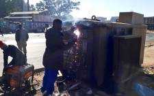 City Power workers weld up an electricity power box to prevent access to cable thieves and vandals. Picture: @JoburgMPD/Twitter