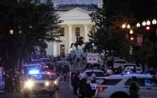 A large law enforcement response is seen near the White House after a protest was dispersed on June 1, 2020 in downtown Washington, DC. Protests and riots continue in cities across America following the death of George Floyd, who died after being restrained by Minneapolis police officer Derek Chauvin. Picture: AFP.