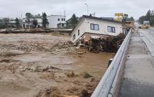 This picture provided by Tokachi Mainichi Newspaper via Jiji Press on 31 August 2016 shows a house swept down a river at the town of Shimizu in Hokkaido prefecture, after Typhoon Lionrock struck overnight. JIJI Press/AFP.
