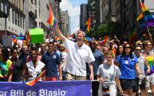 New York City Mayor Bill De Blasio walks alongside parade-goers as they make their way down 5th Avenue during the NYC Pride March on 25 June, 2017. The NYC Pride March celebrates its 48th annual parade. Picture: AFP.