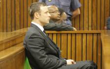 Oscar Pistorius in the dock during judgment in his murder trial in Pretoria on 11 September 2014. Picture: Pool.