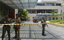 Sri Lankan security personnel stand guard at the cordoned off entrance to the luxury Shangri-La Hotel in Colombo on 21 April 2019 following an explosion. Picture: AFP