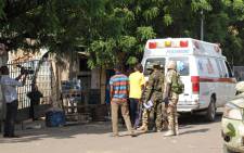 FILE: Emergency services and soldiers gather at the scene of a suicide bomb attack in Maiduguri. Picture: AFP.