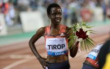 FILE: Agnes Jebet Tirop of Kenya celebrates after winning second-place in the women's 3,000 metres race during the Diamond League athletics competition at the Suhaim bin Hamad Stadium in Doha, on 4 May 2018. Picture: KARIM JAAFAR/AFP