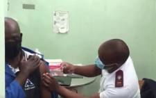 Josias Mmola, aged 62, get his COVID-19 vaccine at the Alexandra community healthcare centre on 17 May 2021. Picture: Eyewitness News.