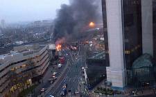 A collect picture taken by a member of the public shows the scene of a helicopter crash in central London on 16 January 2013. Picture: AFP