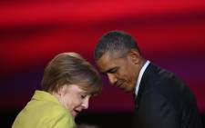 FILE. US President Barack Obama and German Chancellor Angela Merkel attend during the official opening ceremony of the Hanover industry Fair at the Hannover Congress Center HCC in Hanover, on 24 April, 2016. Picture: AFP.