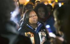 Dorothy Holmes, the mother of Ronald Johnson, joins demonstrators protesting the shooting death of her son on 7 December 2015 in Chicago, Illinois. Police say Johnson had a gun in his hand when he was shot; Johnsons family and their attorney dispute this claim. Picture: AFP