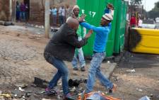 The fatal stabbing of Mozambican national Emmanuel Josias in Alexandra captured by James Oatway of the Sunday Times.
