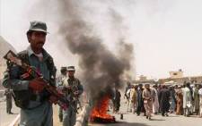 Afghanistan police stand guard as people protest. Picture: AFP