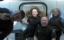 This file photo shows the Inspiration4 crew (L-R) Jared Isaacman, Hayley Arceneaux, Christopher Sembroski and Sian Proctor in orbit.  Picture: AFP/courtesy of Inspiration4