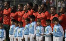 South Africa's Springboks -wearing a limited-edition alternate jersey marking the 25th anniversary of the end of apartheid in South Africa's rugby- pose during the anthem ceremony before the start of the Rugby Championship match against Argentina's Los Pumas at Padre Ernesto Martearena stadium in Salta some 1550 Km north-west of Buenos Aires, Argentina on 26 August, 2017. Picture: AFP.