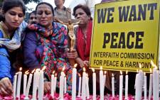 FILE: Pakistani civil activists take part in a protest vigil against the killing of a Christian couple who were burnt alive for alleged blasphemy, in Kot Radha Kishan, in Karachi, Pakistan, 07 November 2014. Picture: EPA.