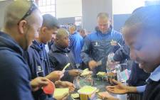 Cobras coach Paul Adams and his team do their bit for Mandela Day at Thandokhulu Secondary School in Mowbray. Picture: Alicia Pillay/EWN