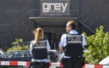 Policemen stand in front of the Grey nightclub in Konstanz (Constance), southern Germany, where a gunman opened fire, killing one and wounding four people before being shot by police, on July 30, 2017. German police said they did not believe that the shooting was a terror attack. Picture: AFP.