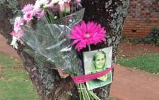 A picture of Chanelle Henning is placed on a tree with flowers at the spot where she died on 8 November, 2011. Picture: Barry Bateman/EWN.