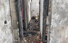 Rubble in the passage of a house in Kirkney village in Pretoria West following a deadly fire on 10 November 2021. Five family members lost their lives. Picture: Boikhutso Ntsoko/Eyewitness News