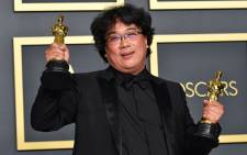 Director Bong Joon-ho, winner of the Original Screenplay, International Feature Film, Directing, and Best Picture awards for Parasite, poses in the press room during the 92nd Annual Academy Awards at Hollywood and Highland on 9 February 2020 in Hollywood, California. Picture: AFP