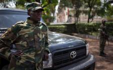The head of the M23 rebel military forces, Brigadier-General Sultani Makenga leans on a car on November 25, 2012 on the grounds of a military residence in Goma. Picture: AFP.