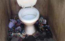 The bodies of two little girls were removed from this toilet cubicle where they were found dumped. Picture: Lesego Ngobeni/EWN