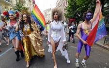 Waving rainbow and Ukrainian flags, dressed in bright colours, LGBTQIA+ members marched through the centre of the capital on 23 June 2019, as thousands of police and National Guards stood by to ensure order. Picture: AFP