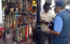 FILE: An informal trader speaks to a policeman. Picture: Giovanna Gerbi/EWN.
