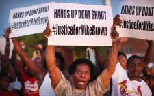 Demonstrators protest the killing of teenager Michael Brown. United states, St. Louis on 12 August. Picture: AFP