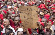 A protester holds up a placard at the "Day of Action" march against the leadership of President Jacob Zuma held in Pretoria on 12 March 2017. Picture: Reinart Toerien/EWN
