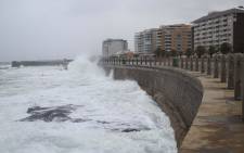 Waves crash on Sea Point promenade near Mouille Point as a cold front creeps into Cape Town. Picture: Bertram Malgas/EWN