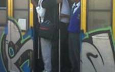 FILE: Commuters hang out of a Metrorail train in Cape Town. Picture: Supplied