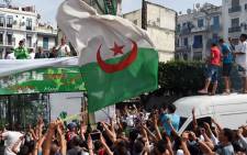  Algerian national team players are greeted by fans upon their return from the 2014 FIFA World Cup in Brazil, on 2 July, 2014, in the capital Algiers. Picture: AFP. 