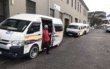 A taxi operator waits to sanitise the hands of passengers in Wynberg on 24 March 2020. Picture: Lizell Persens/EWN