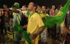 Hundreds of Brazil fans watch in shock as their country was knocked out of the World Cup after they were beaten 7-1 by Germany in the semifinals on 8 July 2014. Picture: Christa Eybers/EWN.