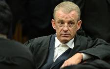 State prosecutor Gerrie Nel is seen during a break in proceedings at the murder trial of double amputee Paralympian Oscar Pistorius at the North Gauteng High Court in Pretoria 4 March 2014. Picture: Pool