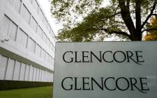 FILE: A picture taken on 10 October 2015 shows the logo of Glencore at the Swiss commodity trading giant's headquarters in Baar, central Switzerland. Picture: AFP.