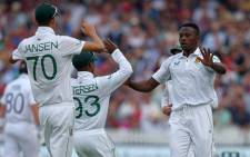 South Africa's Kagiso Rabada (R) celebrates with teammates after taking the wicket of England's Zak Crawley during play on the opening day of the first Test match between England and South Africa at the Lord's cricket ground in London on 17 August 2022. Picture: Adrian DENNIS/AFP