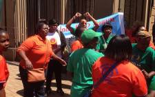 Members of the Diepsloot Early Childhood Development Forum sing outside court after sentencing was handed on 29 October 2014. Picture: Reinart Toerien/EWN.