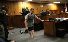 Oscar Pistorius walks on his stumps during a demonstration in court on 15 June 2016. Picture: Pool.