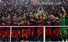 Barcelona players celebrate with the trophy after winning the European Super Cup with a 5-4 win over Sevilla on 11 August 2015. Picture: Barcelona/Facebook.