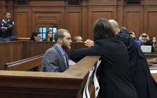 Family axe murderer Henri van Breda speaking to his lawyers during sentencing procedures at the Western Cape High Court on 5 June. Picture: Monique Mortlock/EWN